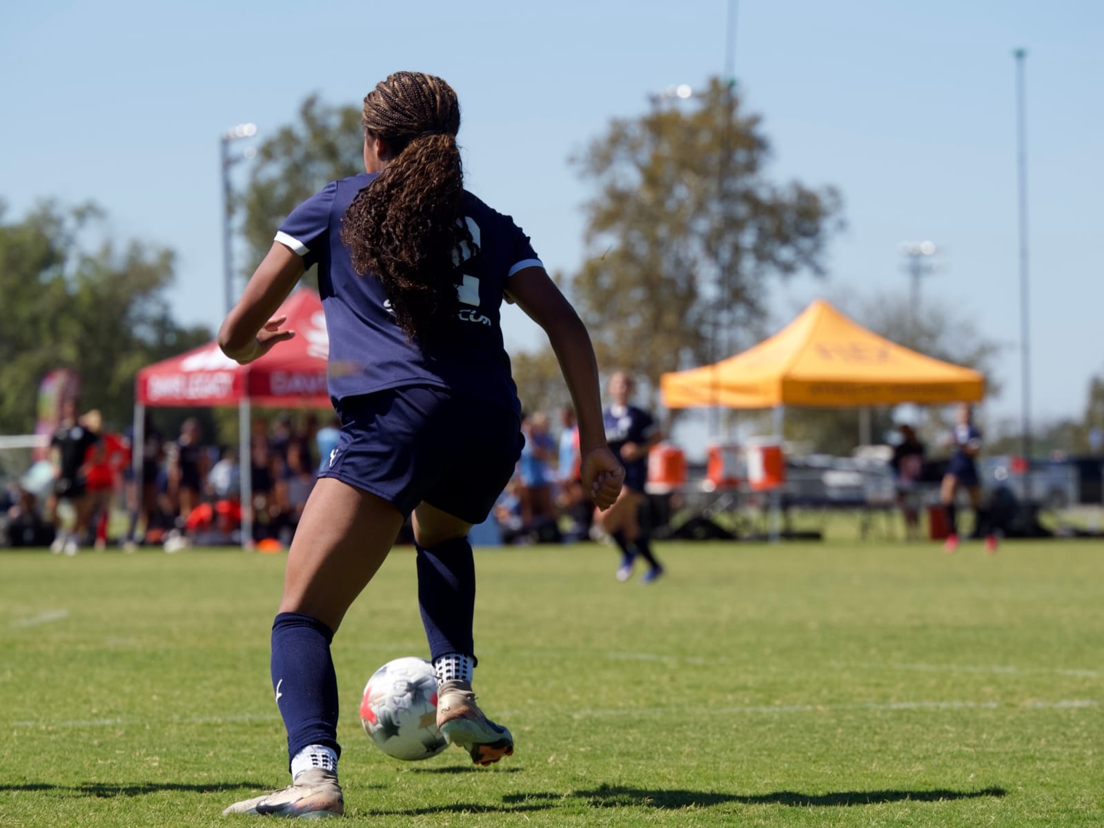 Ball at feet in the open field